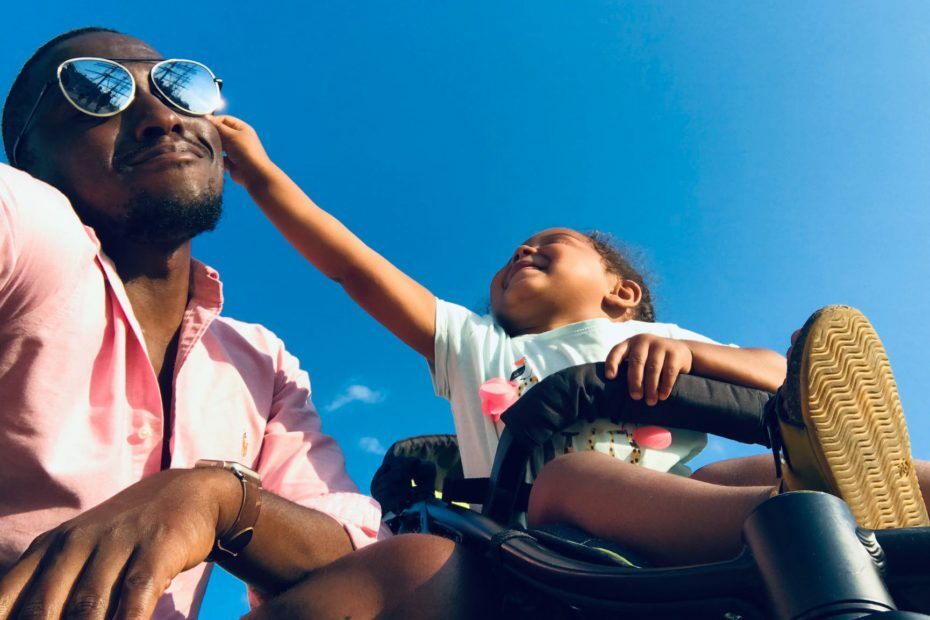 baby approaching men s black sunglasses