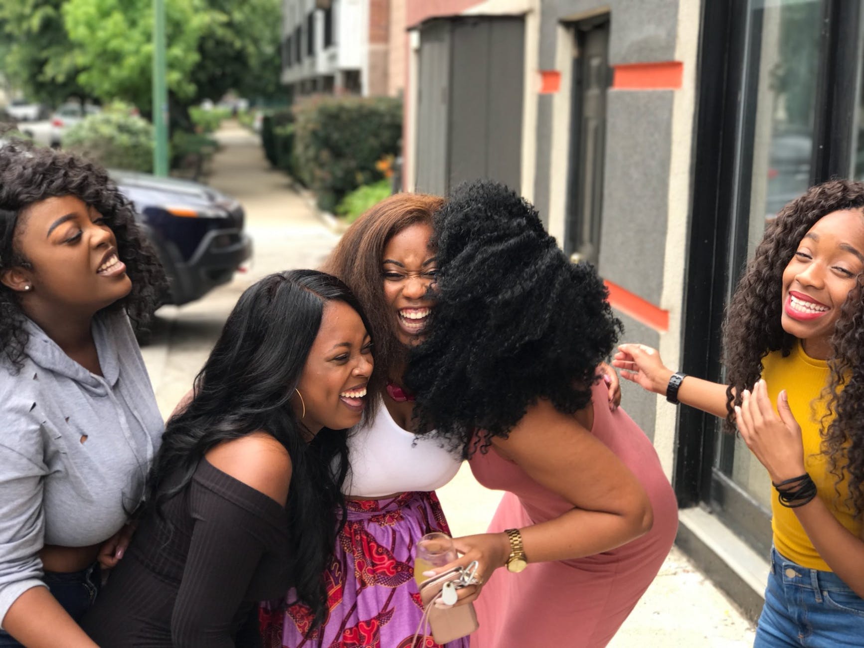 five women laughing